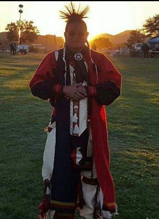Indigenous hoop dancer performing with hoops